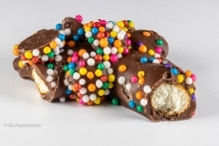 Sprinkles and chocolate chips on pretzel Sprinkles and chocolate chips on pretzel